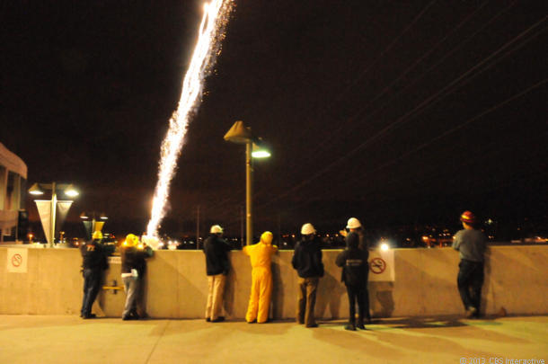 The pyro crew watches the first shells fire high into the sky. (Credit: Daniel Terdiman/CNET)