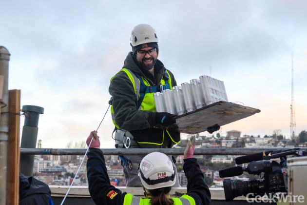 Watch workers scale the Space Needle, transform Seattle landmark for New Year’s fireworks show