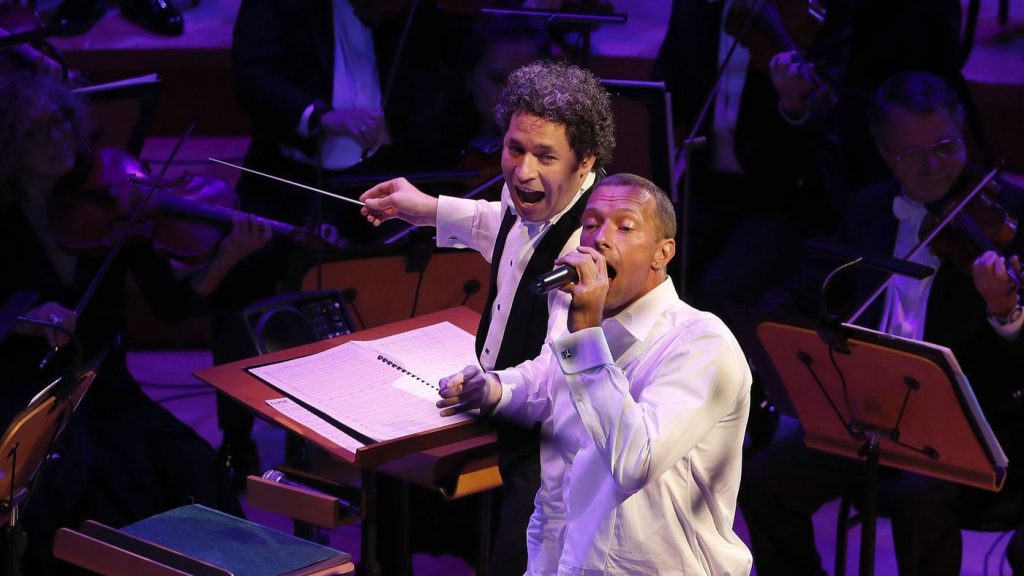 Chris Martin sings the Beach Boys' "Good Vibrations" while Gustavo Dudamel conducts the Los Angeles Philharmonic to conclude the "California Soul" opening night gala concert. (Luis Sinco / Los Angeles Times)