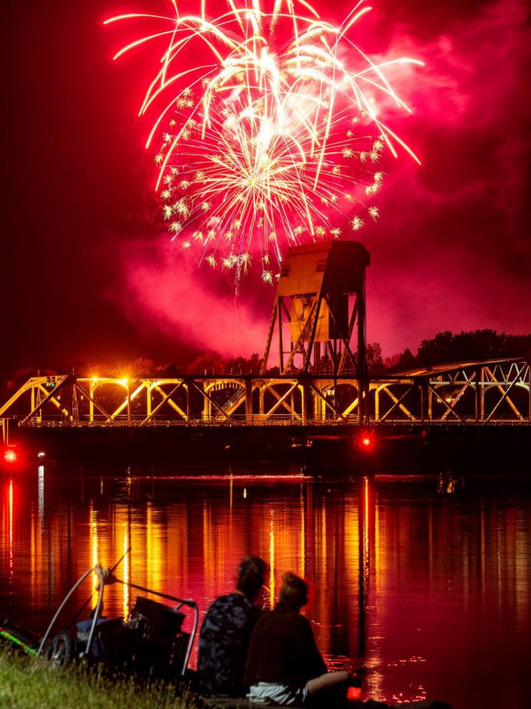 People watch the show from the Lewiston levee