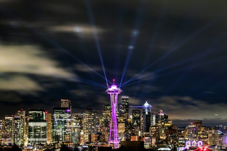Lights shine from the Space Needle, celebrating the new decade a few minutes after midnight in this view from Kerry Park in Seattle on Jan. 1, 2020. (Andy Bao / The Seattle Times)