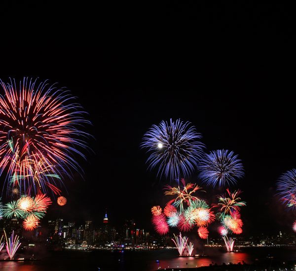 WEEHAWKEN, NJ. - JULY 4: The New York City skyline is seen in the distance as fireworks explode over the Hudson River during the Macy's fireworks display July 4, 2009 in Weehawken, New Jersey. It was the first time since 2000 that the Macy's display took place over the Hudson River and not the East River. (Photo by Yana Paskova/Getty Images)